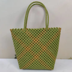 Limited edition handmade PE rattan bag crafted by artisans.