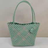 Limited edition handmade PE rattan bag crafted by artisans.