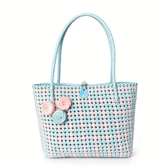 Handwoven pastel pink and blue PE rattan tote bag with floral details.