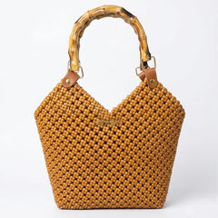 Handwoven PE rattan tote bag with a natural bamboo handle in warm caramel brown.