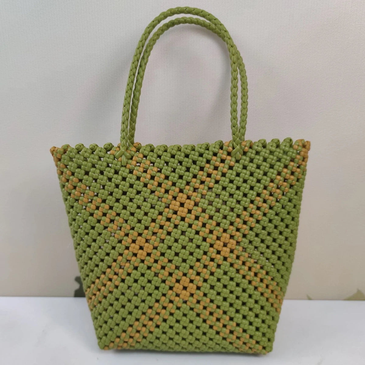 Limited edition handmade PE rattan bag crafted by artisans.
