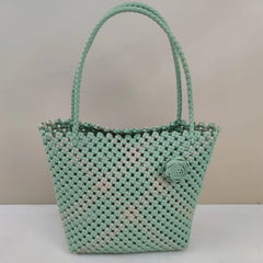 Limited edition handmade PE rattan bag crafted by artisans.