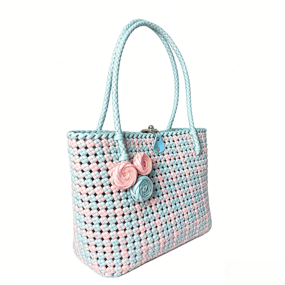 Floral detail on a handmade pastel PE rattan woven tote bag.