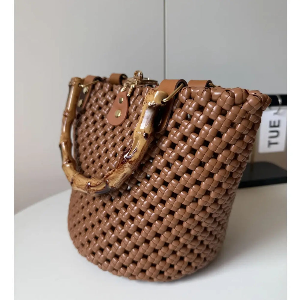Side view of a woven PE rattan bucket bag