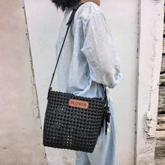 Handmade bag created with soft PU leather weaving strips.